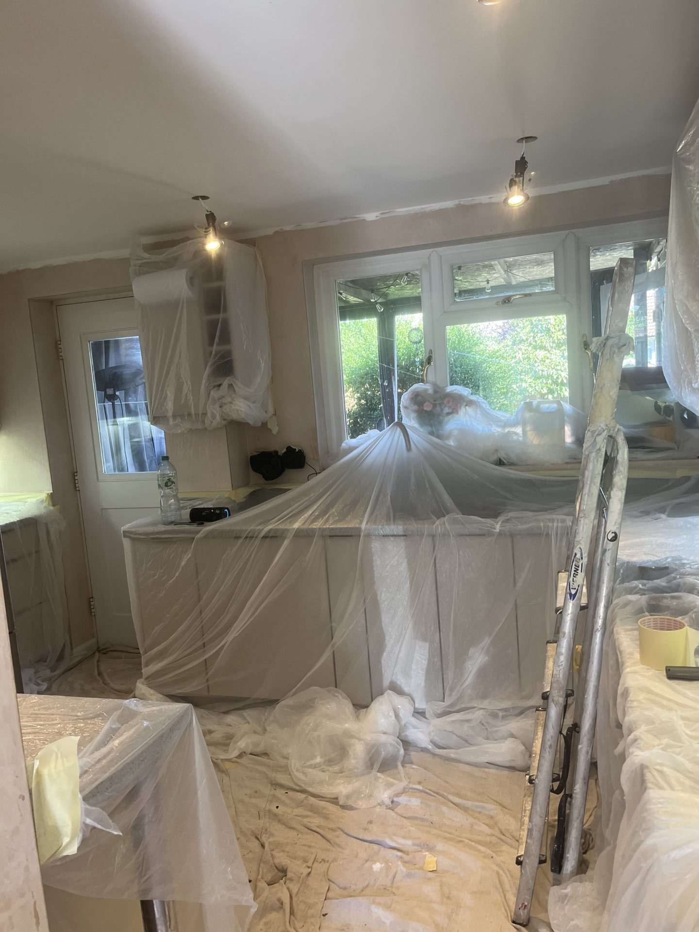 Renovation site with plastic coverings